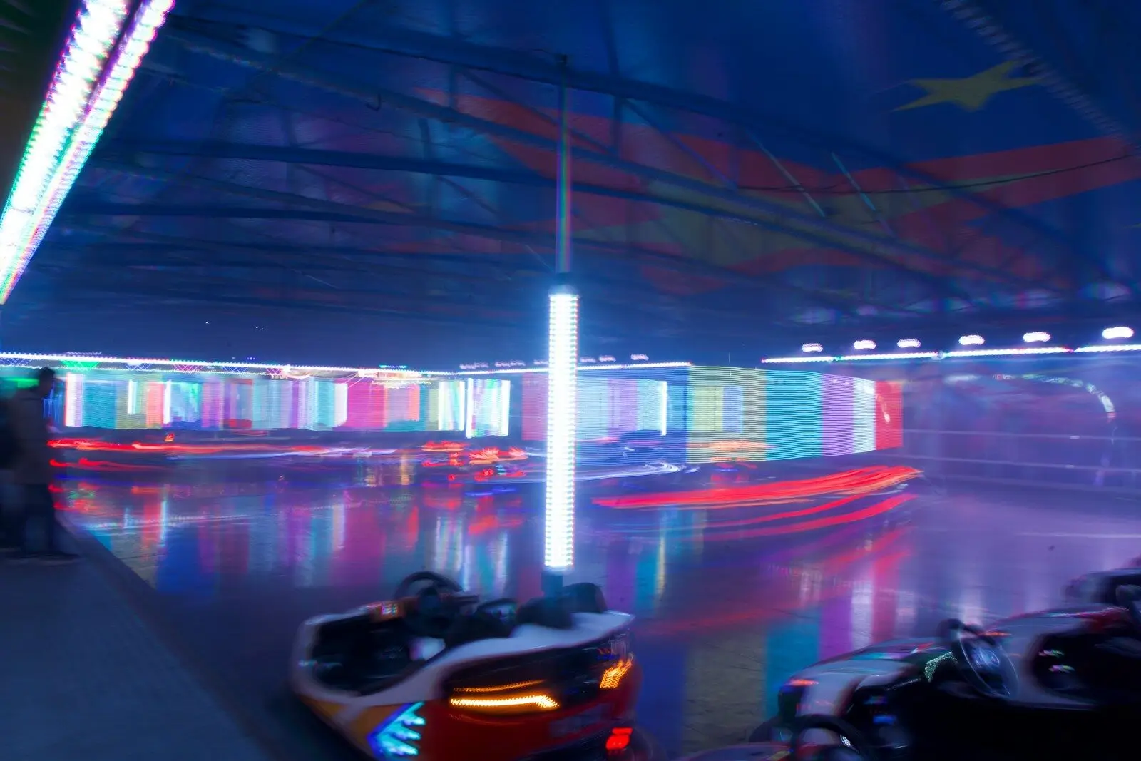 Bumper cars at an amusement park at night