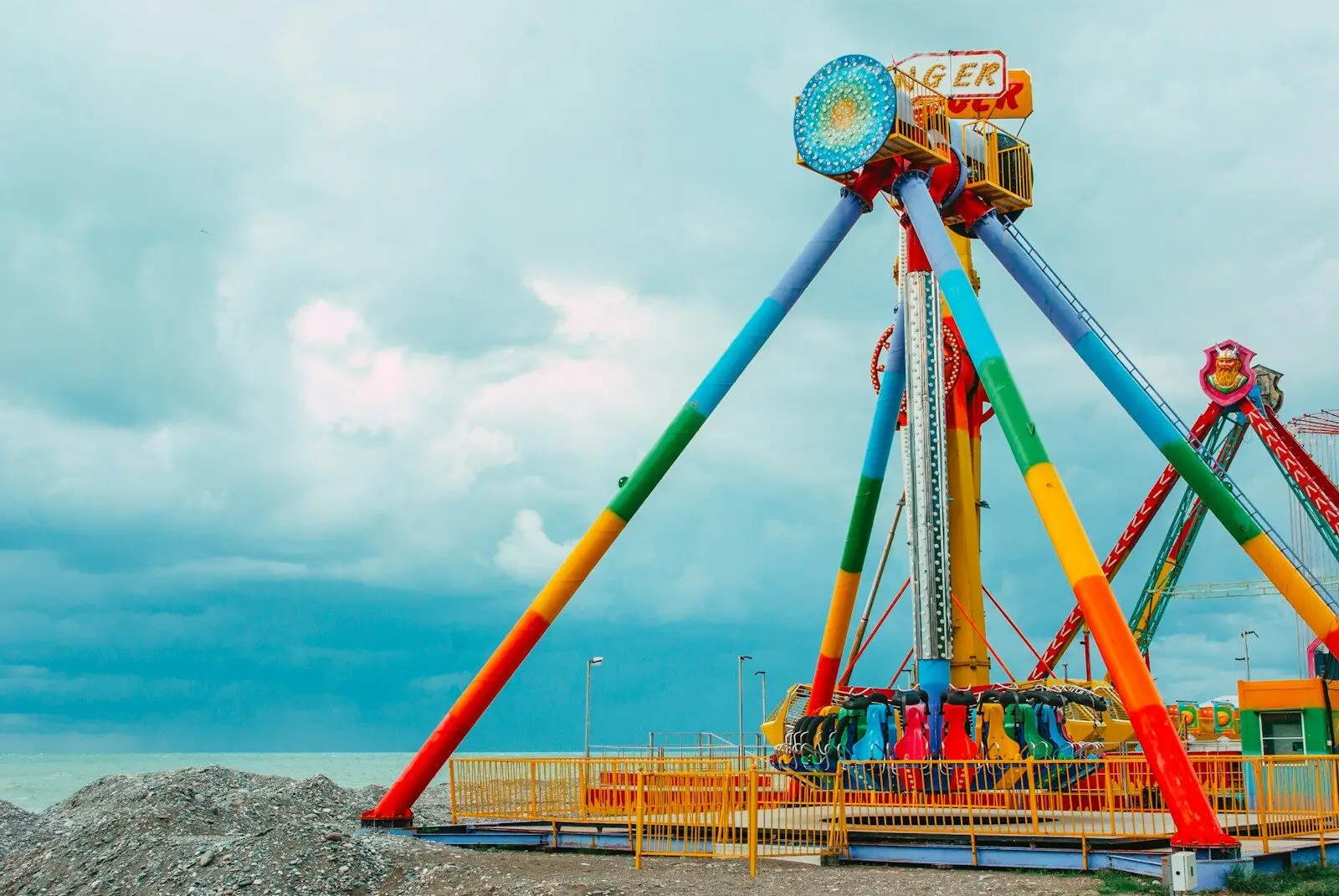 a colorful carnival ride on a cloudy day