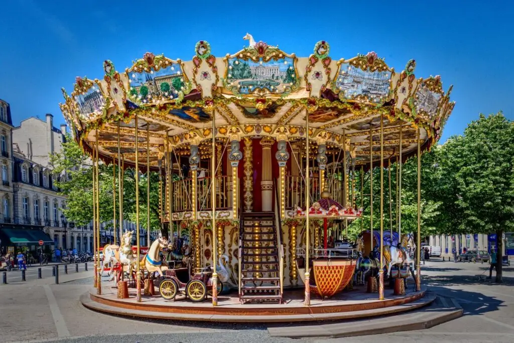 A merry go round in the middle of a city