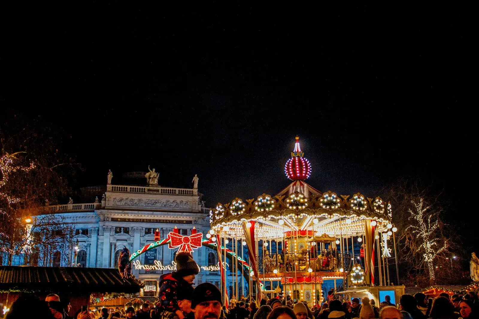 Night view of beautifully lit merry-go-round at amusement park