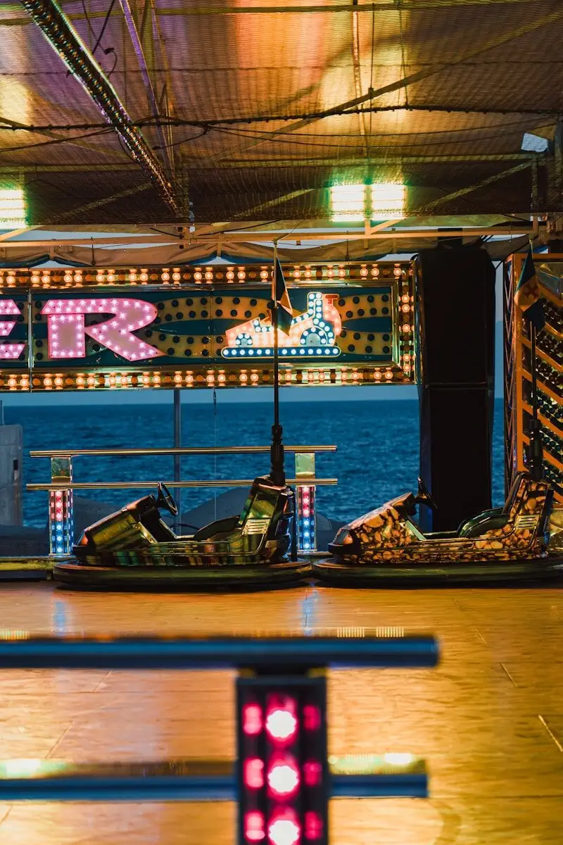 a view of a carnival ride from a bench