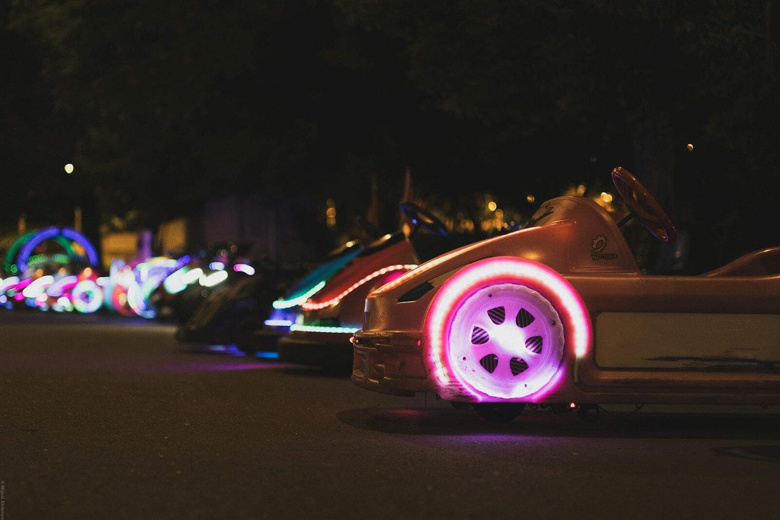Bumper cars with colorful neon lights at night