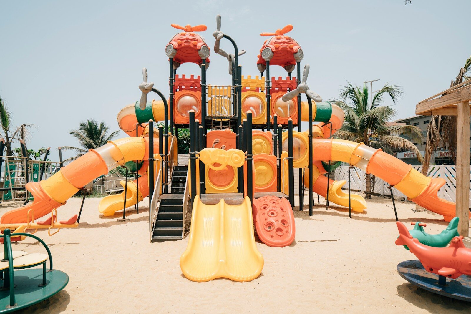 a children's play area with a slide and slides