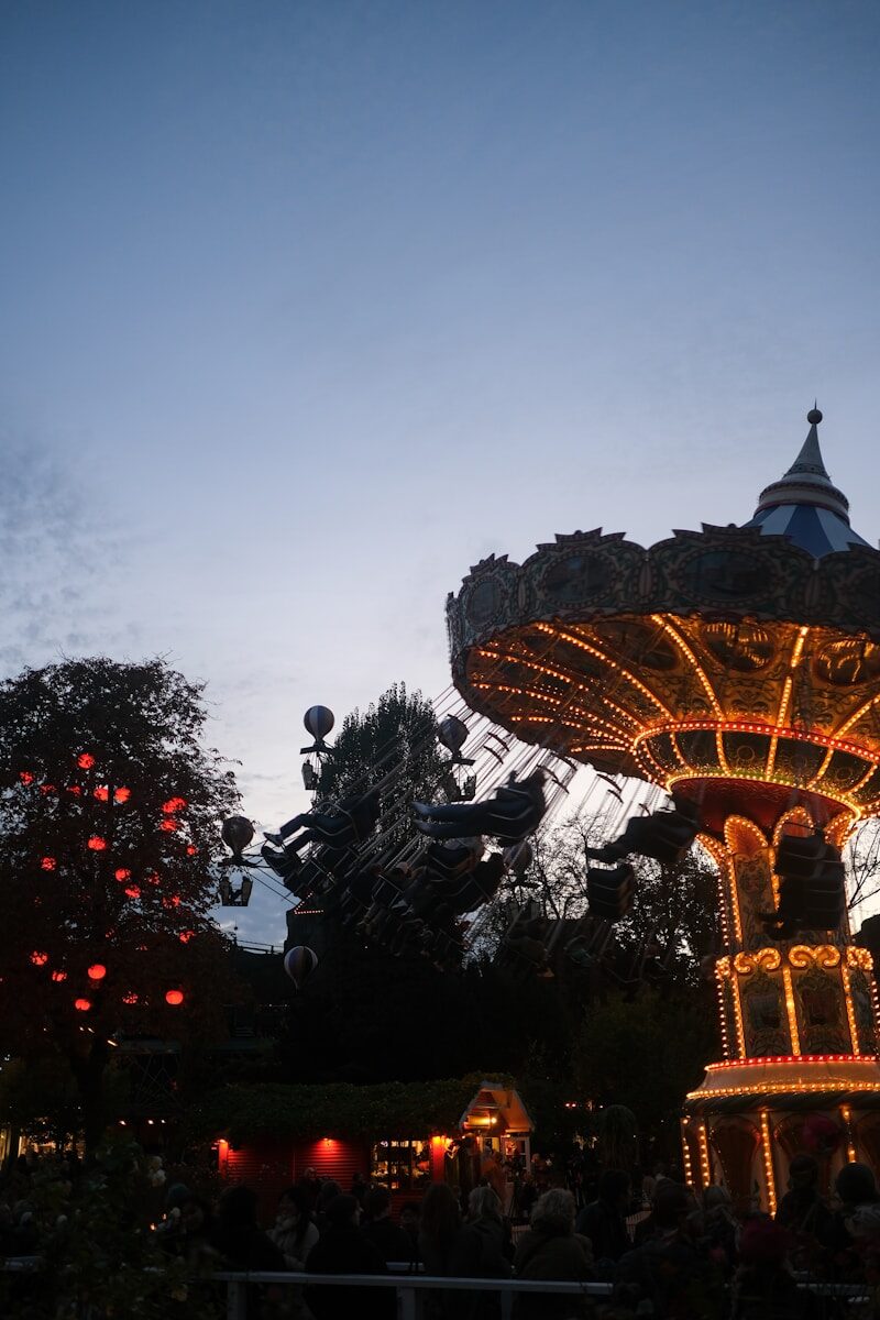 Amusement park carousel and rides at dusk