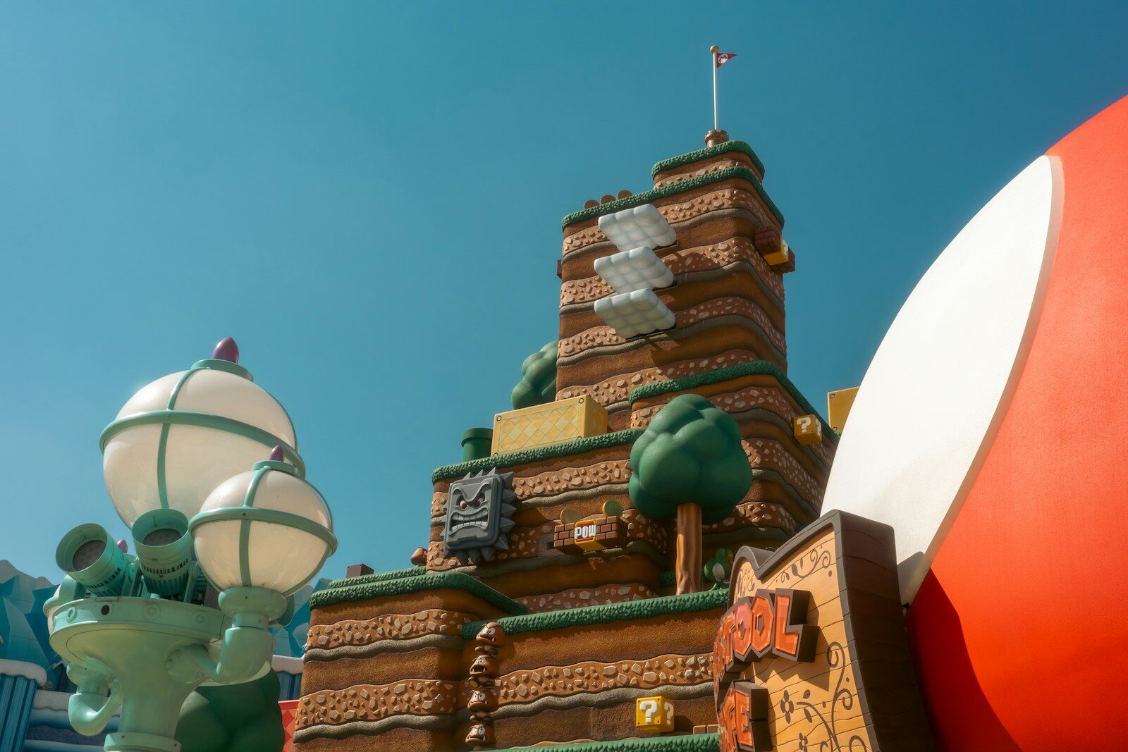 A fantastical brick castle with quirky decorations under-water themed structures