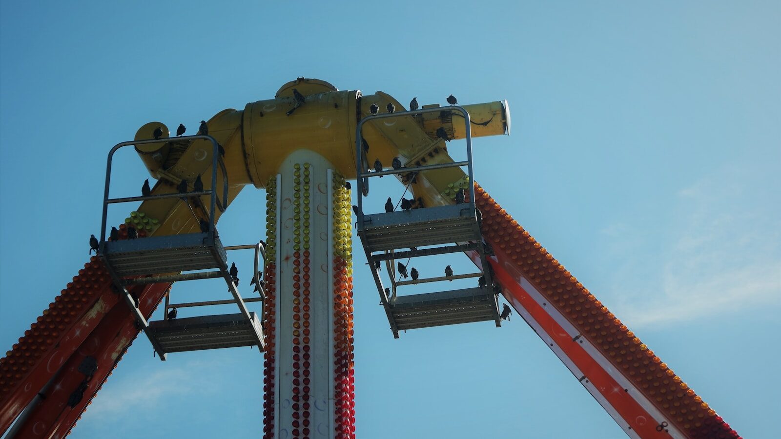 a carnival ride with people on the top of it