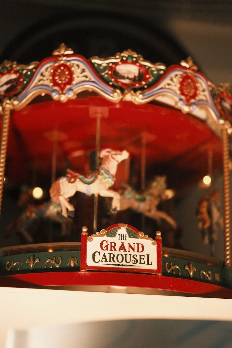 a merry go round with a sign that says the grand carousel