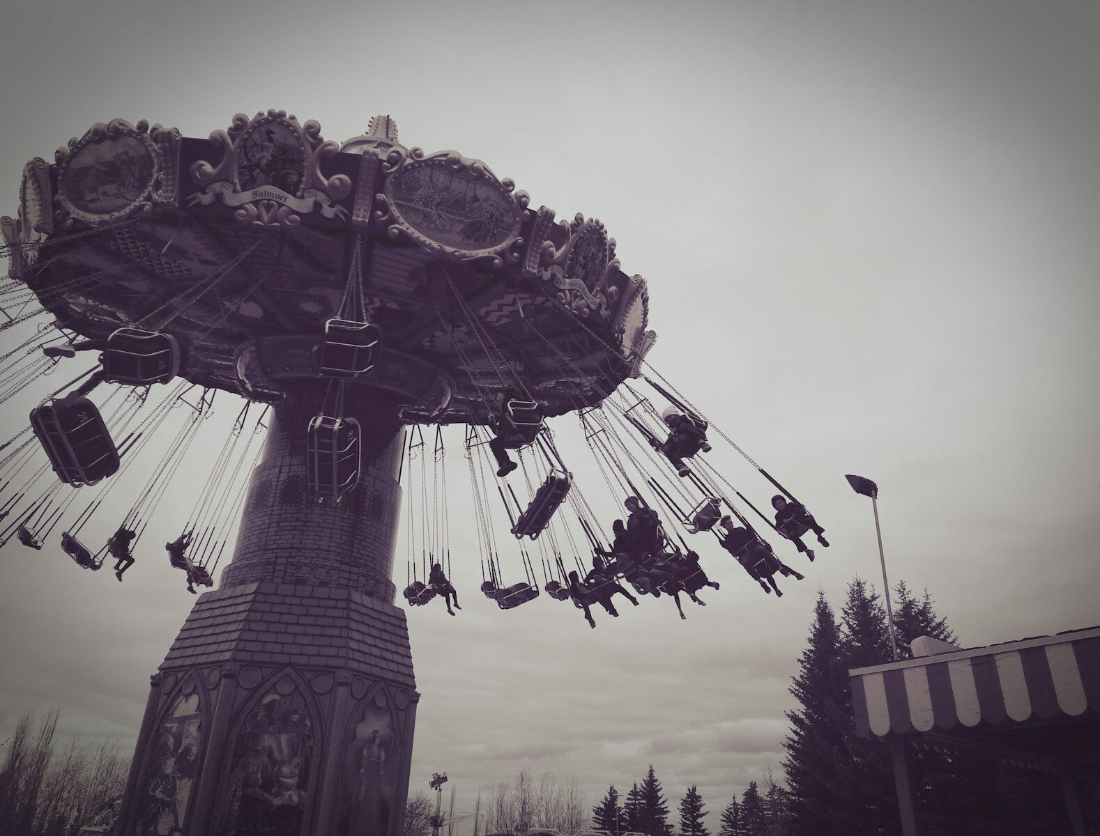 a roller coaster with people riding it