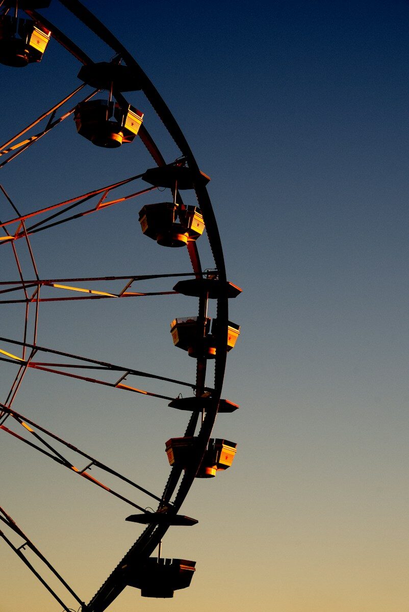 Ferris wheel against a clear evening sky