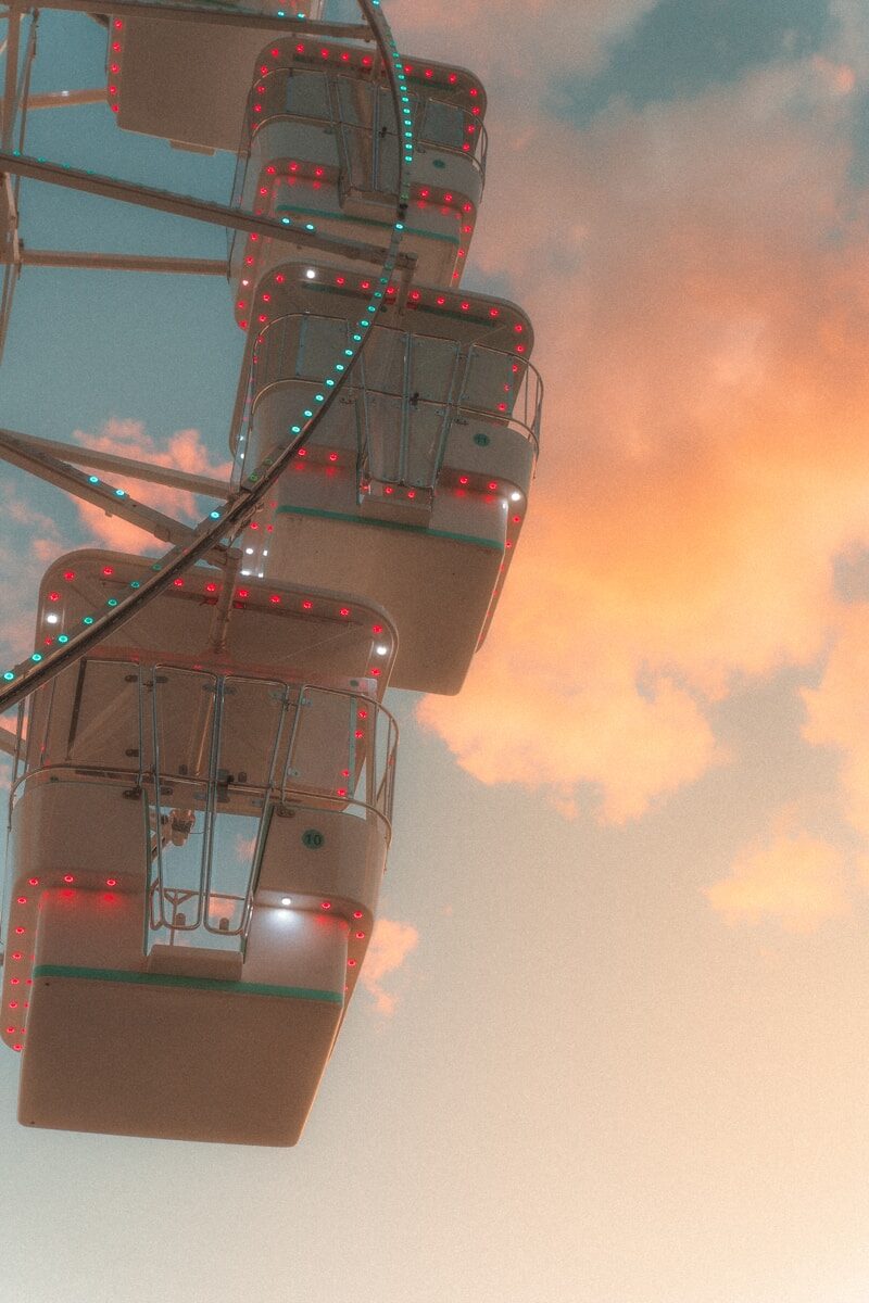 a ferris wheel with a sky in the background