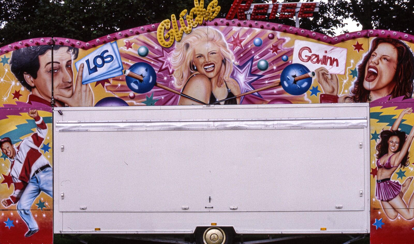 woman in white tank top leaning on white box truck