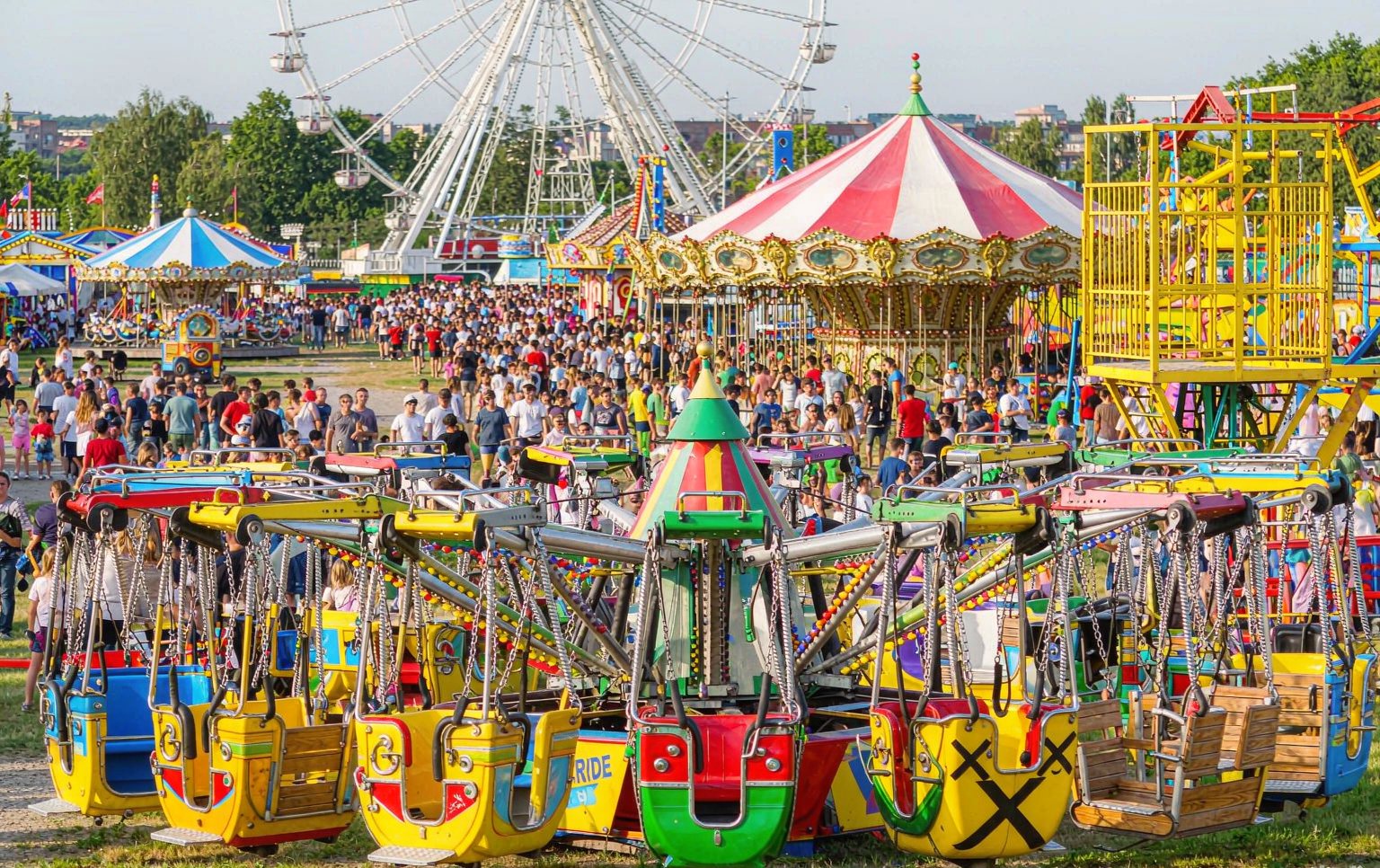 Row of new amusement rides for sale staged at a manufacturer's factory before shipping