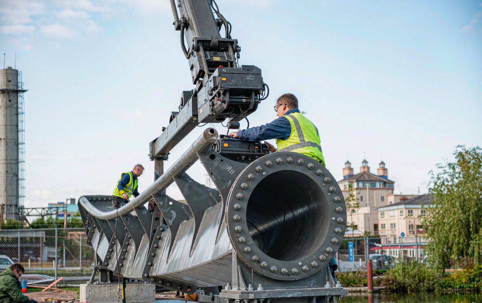 Engineers from roller coaster construction companies assembling steel track sections on site