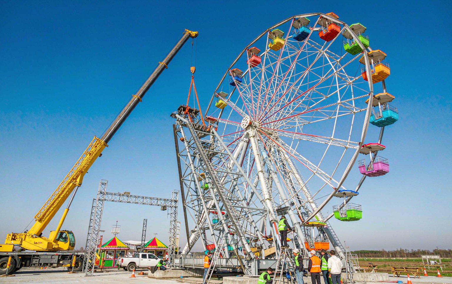 fairground ride manufacturers delivering a custom Ferris wheel installation at a park