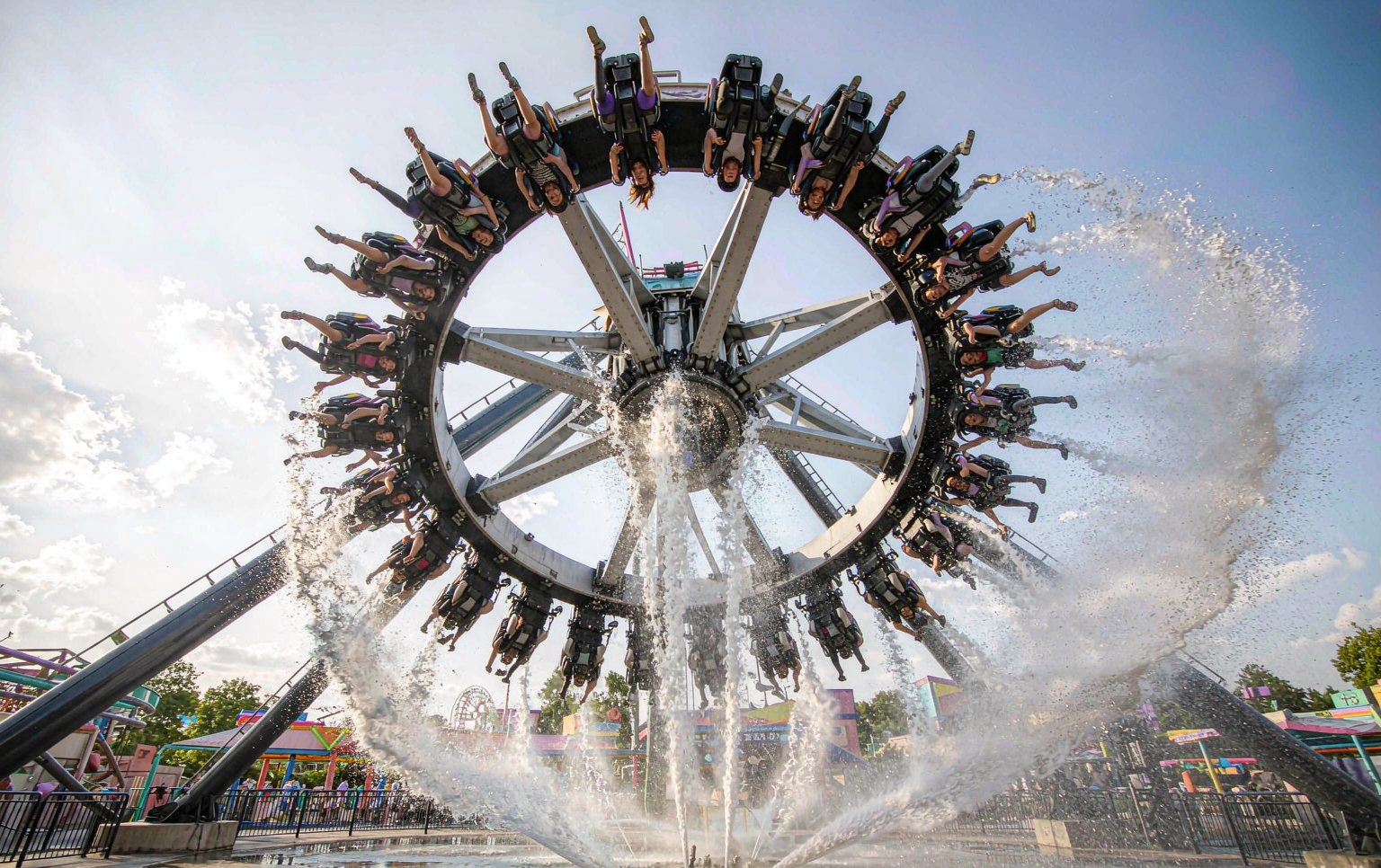 Installed thrill rides for sale at a seaside park with a frisbee and drop tower