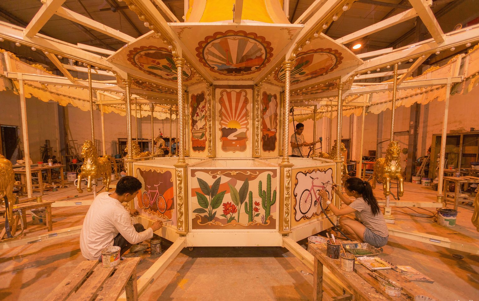Technicians running factory acceptance testing on custom amusement rides before shipment