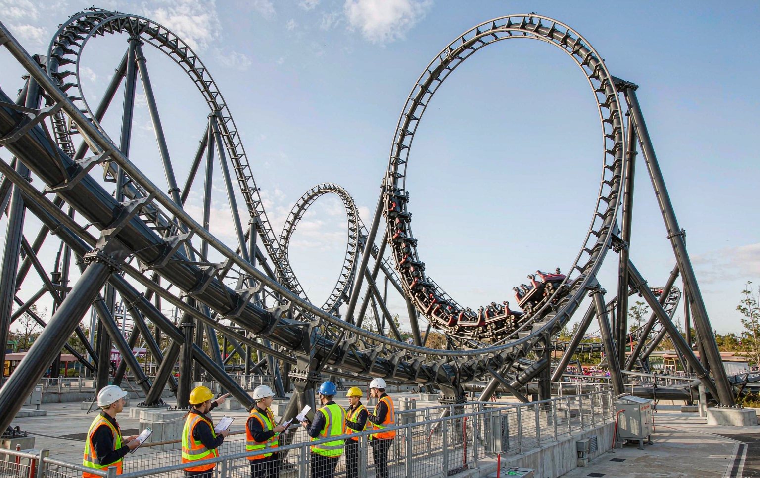 Roller coaster construction companies running a test cycle on a completed steel coaster circuit