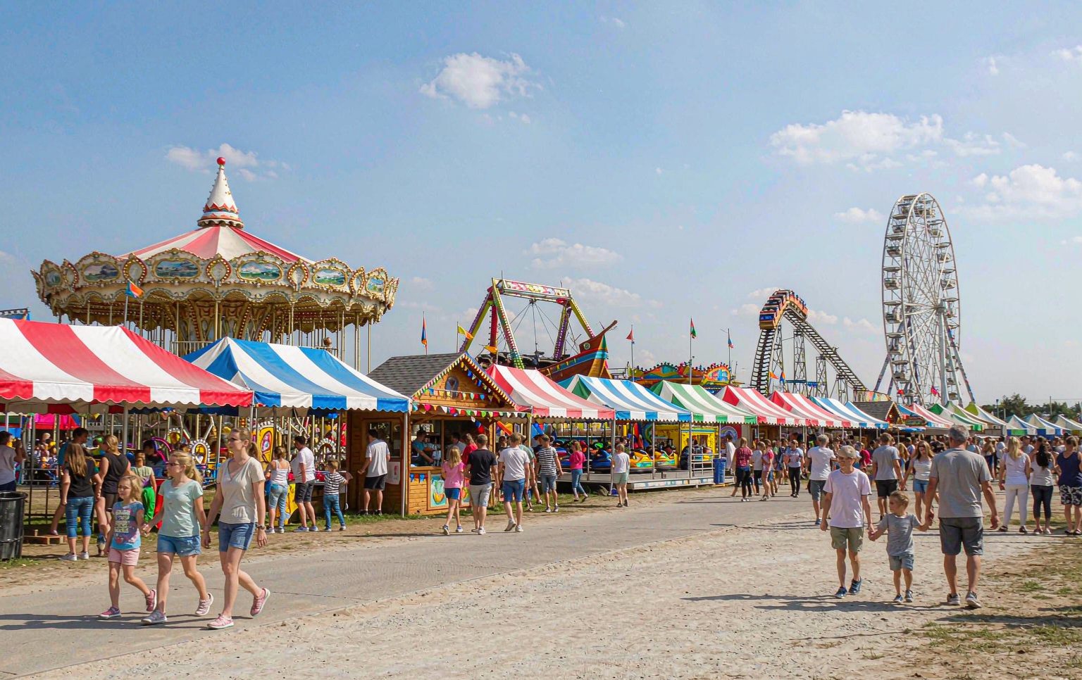 Technician inspecting the restraint system of carnival rides for sale before delivery